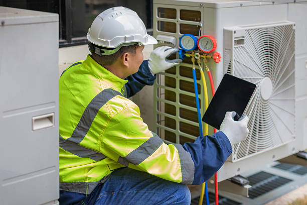 Professional Heat Pump Repair technician working in Oakland City, IN
